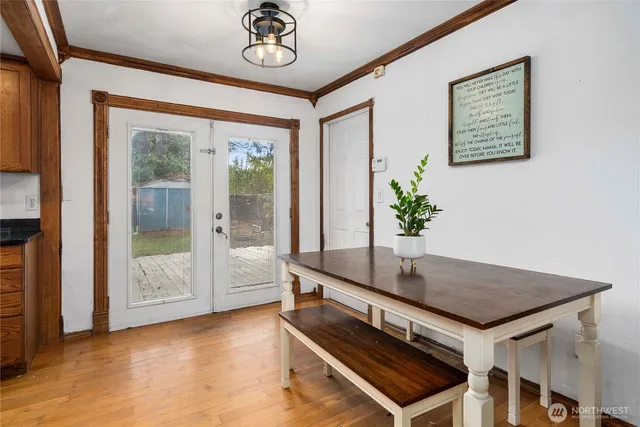 a kitchen with stainless steel appliances granite countertop wooden cabinets a stove top oven a sink and dishwasher