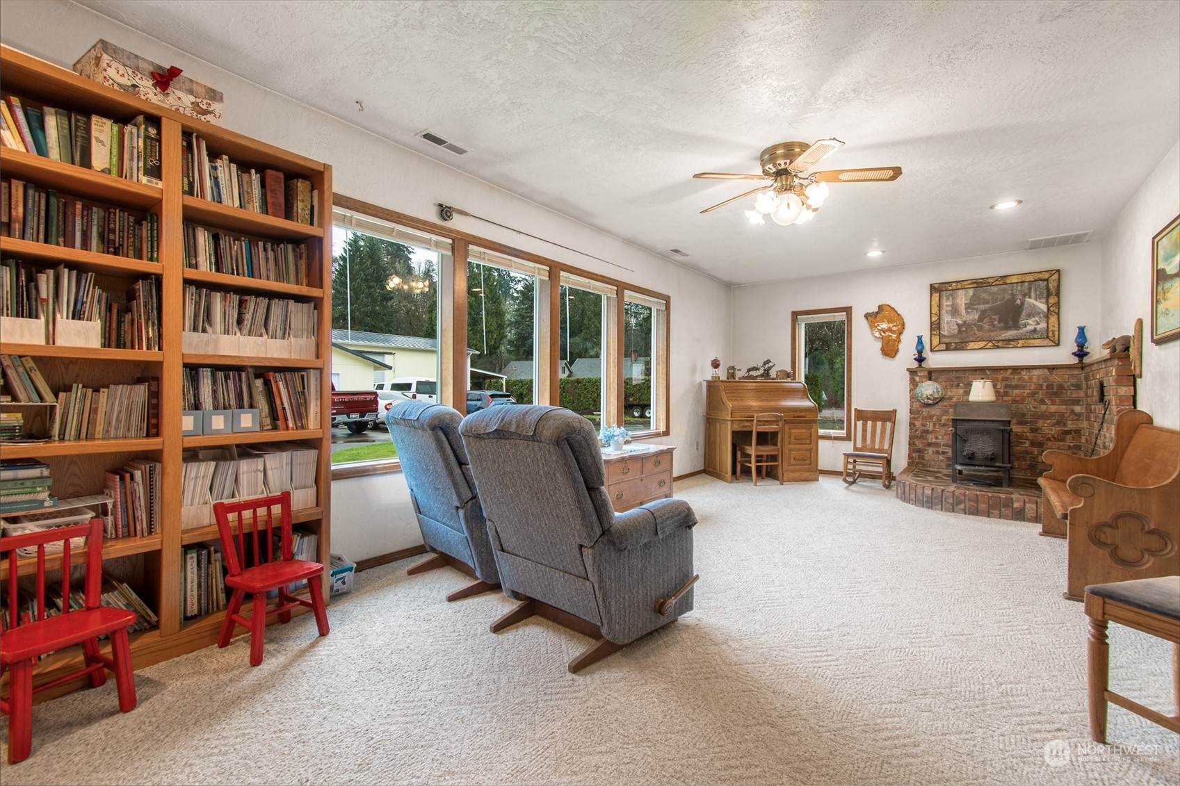 9406 Crete Street Southeast Olympia, WA 98501 - Photo 27 of 38 a living room with furniture and a book shelf