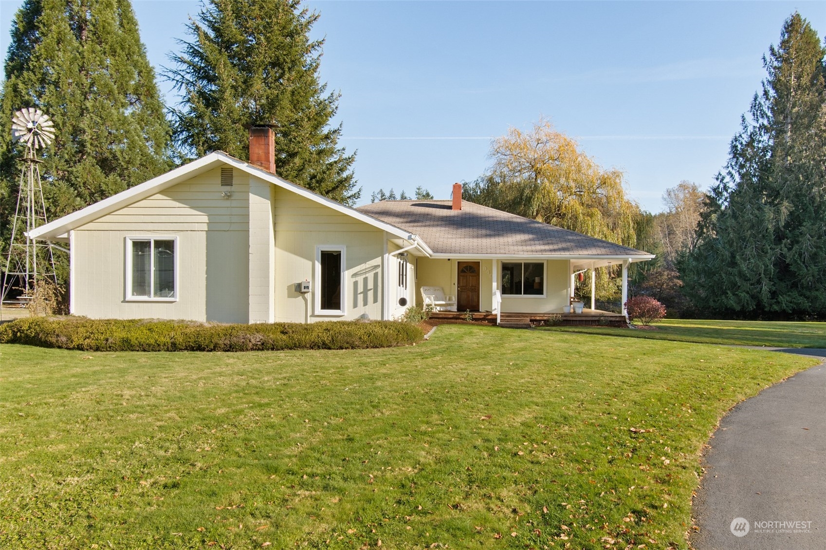 9406 Crete Street Southeast Olympia, WA 98501 - Photo 3 of 38 a front view of a house with a garden
