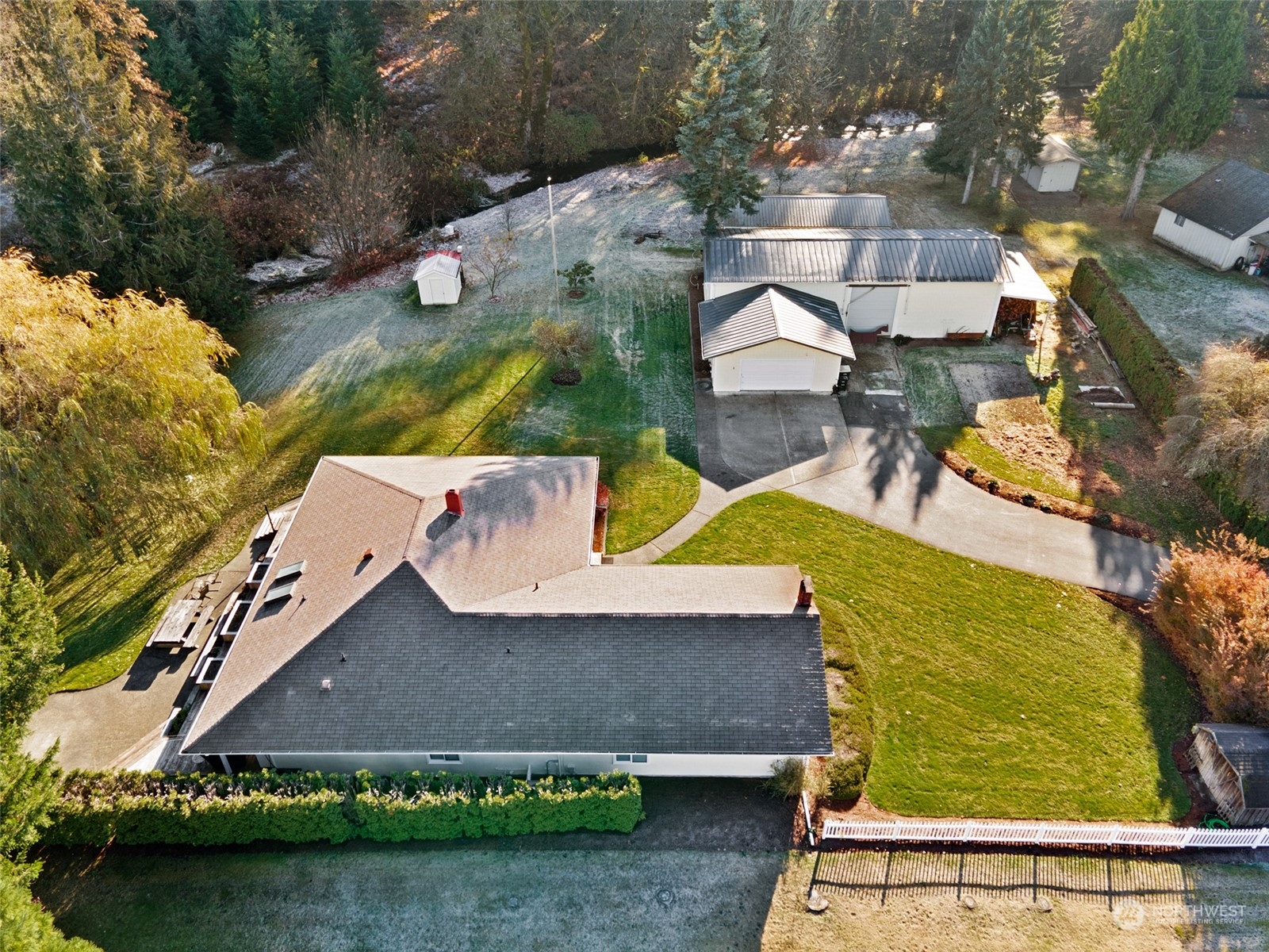 9406 Crete Street Southeast Olympia, WA 98501 - Photo 34 of 38 an aerial view of a house with a garden and lake view