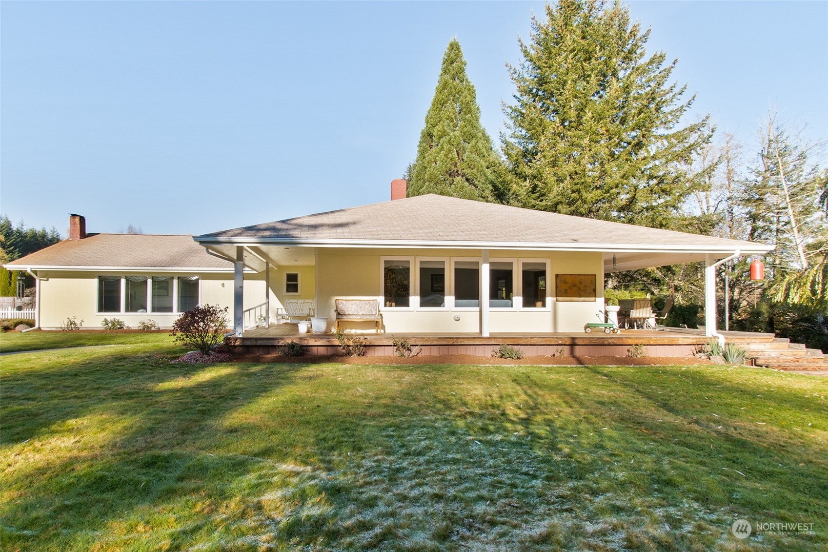 9406 Crete Street Southeast Olympia, WA 98501 - Photo 5 of 38 a front view of a house with a garden