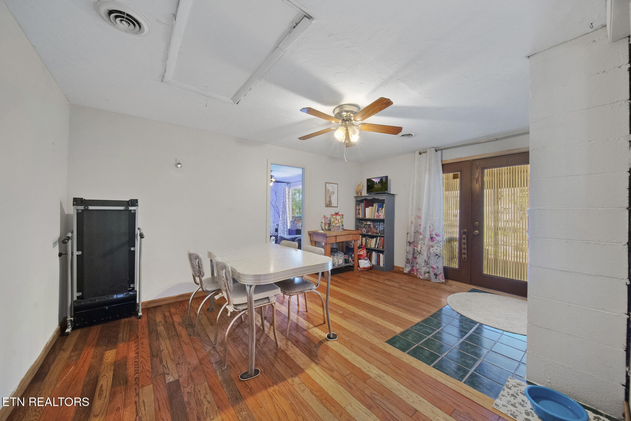 4880 Shell Lane Knoxville, TN 37918 - Photo 11 of 37 a view of a livingroom with furniture a ceiling fan and wooden floor