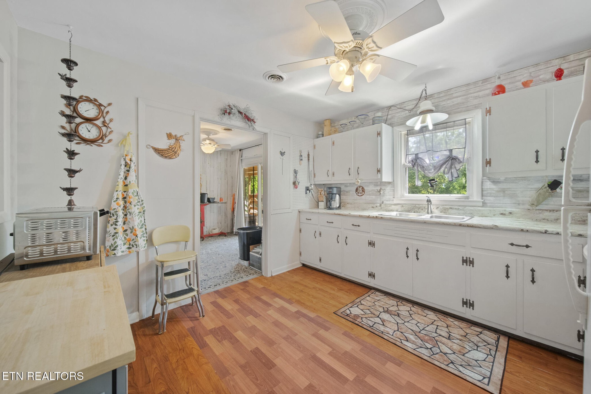4880 Shell Lane Knoxville, TN 37918 - Photo 17 of 37 a large white kitchen with a window and double vanity