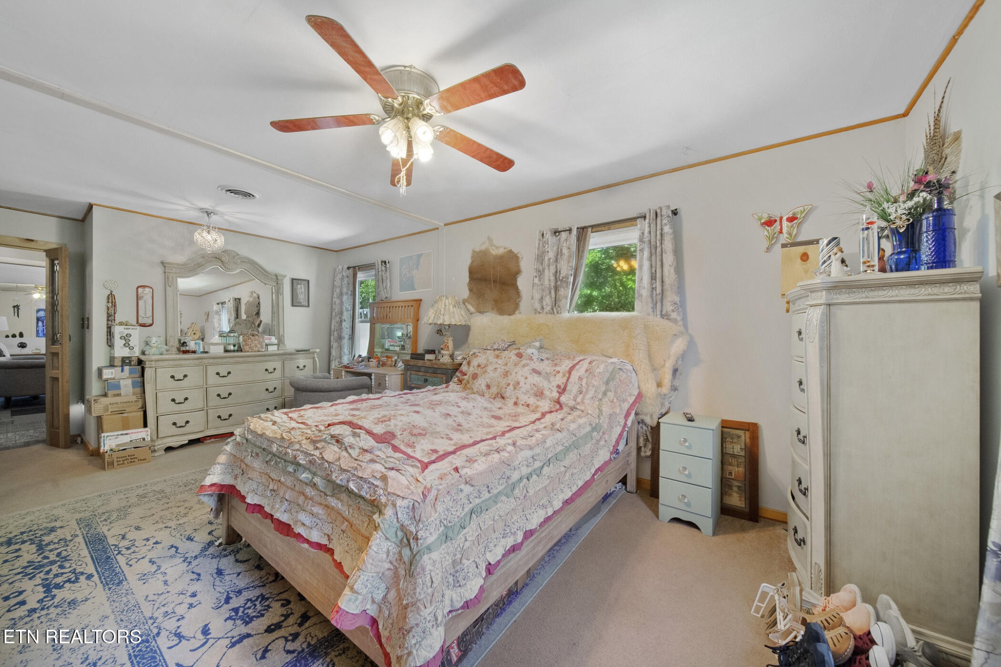 4880 Shell Lane Knoxville, TN 37918 - Photo 26 of 37 a bedroom with a bed and a chandelier