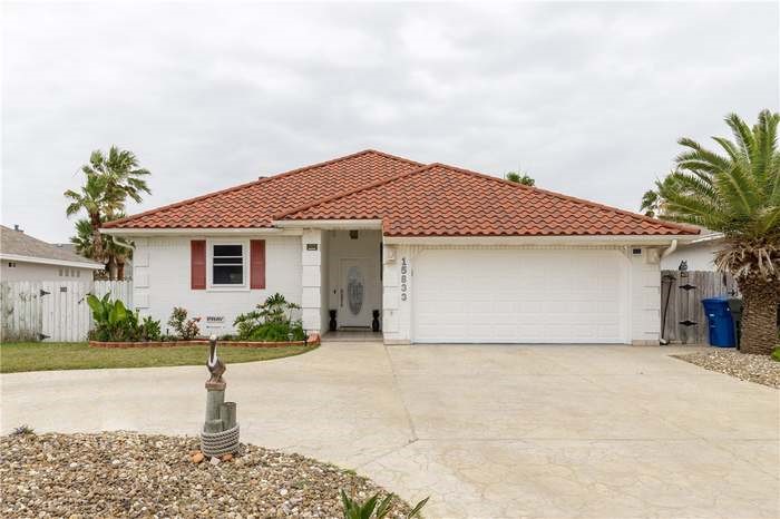 15833 Cuttysark Street Corpus Christi, TX 78418 - Photo 1 of 32 a front view of a house with a garden and yard