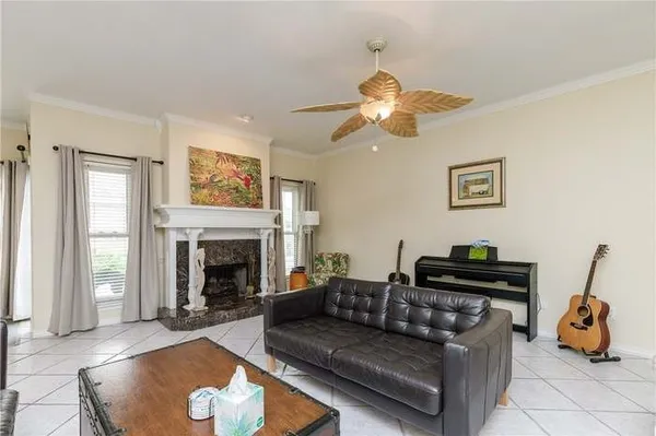 a living room with furniture and a fireplace