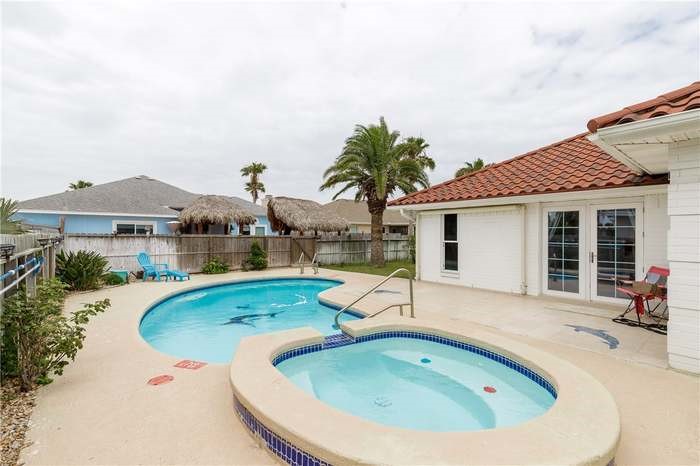 15833 Cuttysark Street Corpus Christi, TX 78418 - Photo 23 of 32 a view of a house with swimming pool and sitting area
