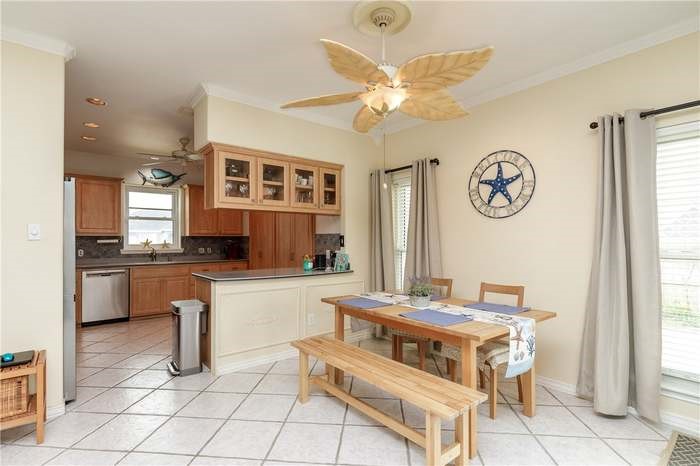 15833 Cuttysark Street Corpus Christi, TX 78418 - Photo 8 of 32 a living room with granite countertop furniture and a large window