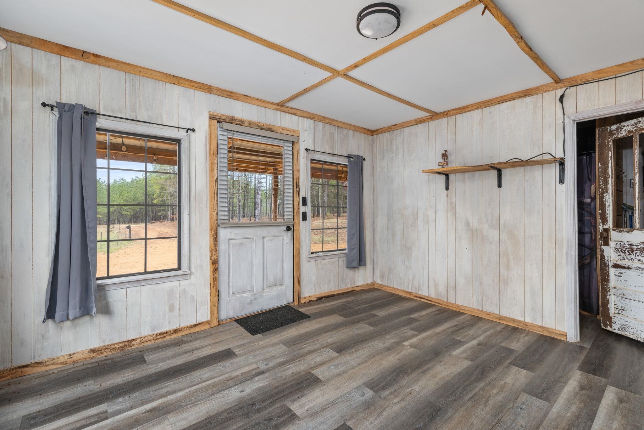 310 County Road 638 Corinth, MS 38834 - Photo 15 of 40 Foyer entrance featuring wood walls and dark wood-style floors