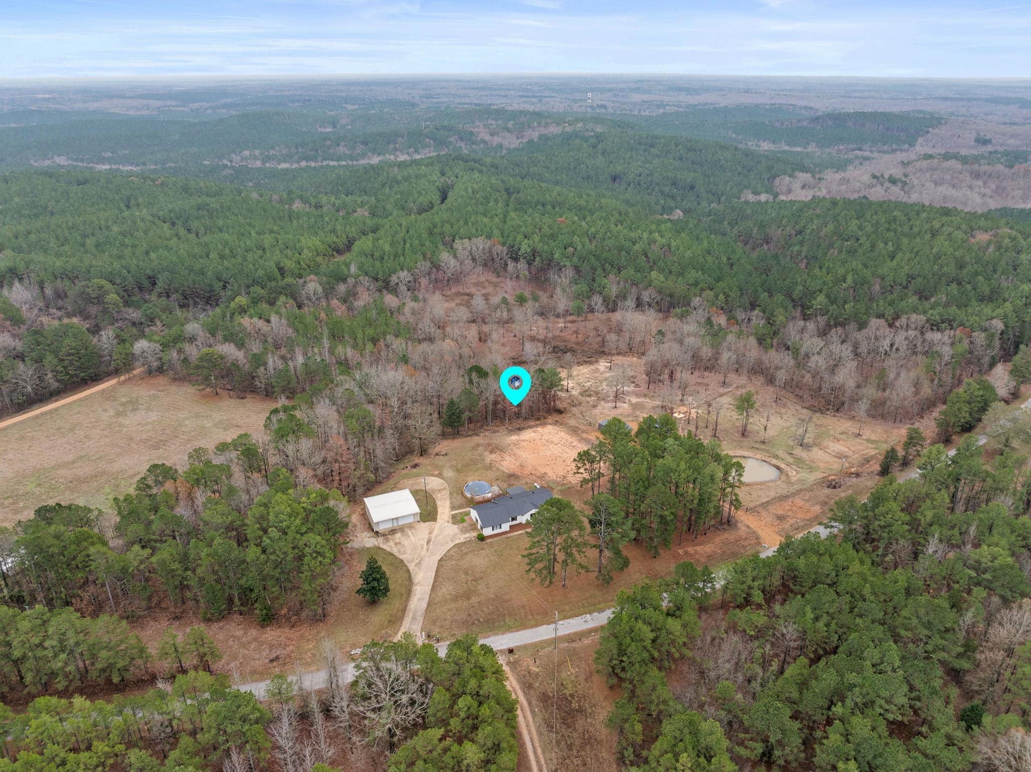 310 County Road 638 Corinth, MS 38834 - Photo 36 of 40 Aerial overview of property's location with a forest