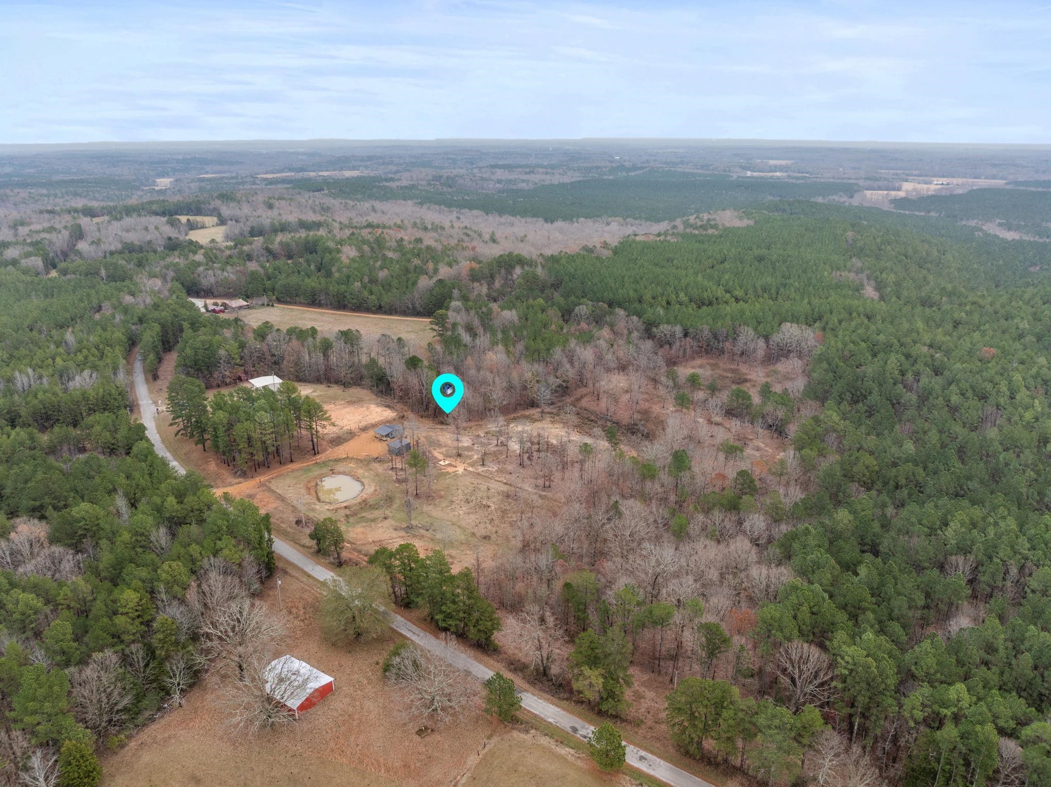 310 County Road 638 Corinth, MS 38834 - Photo 37 of 40 Aerial view of property and surrounding area featuring a forest