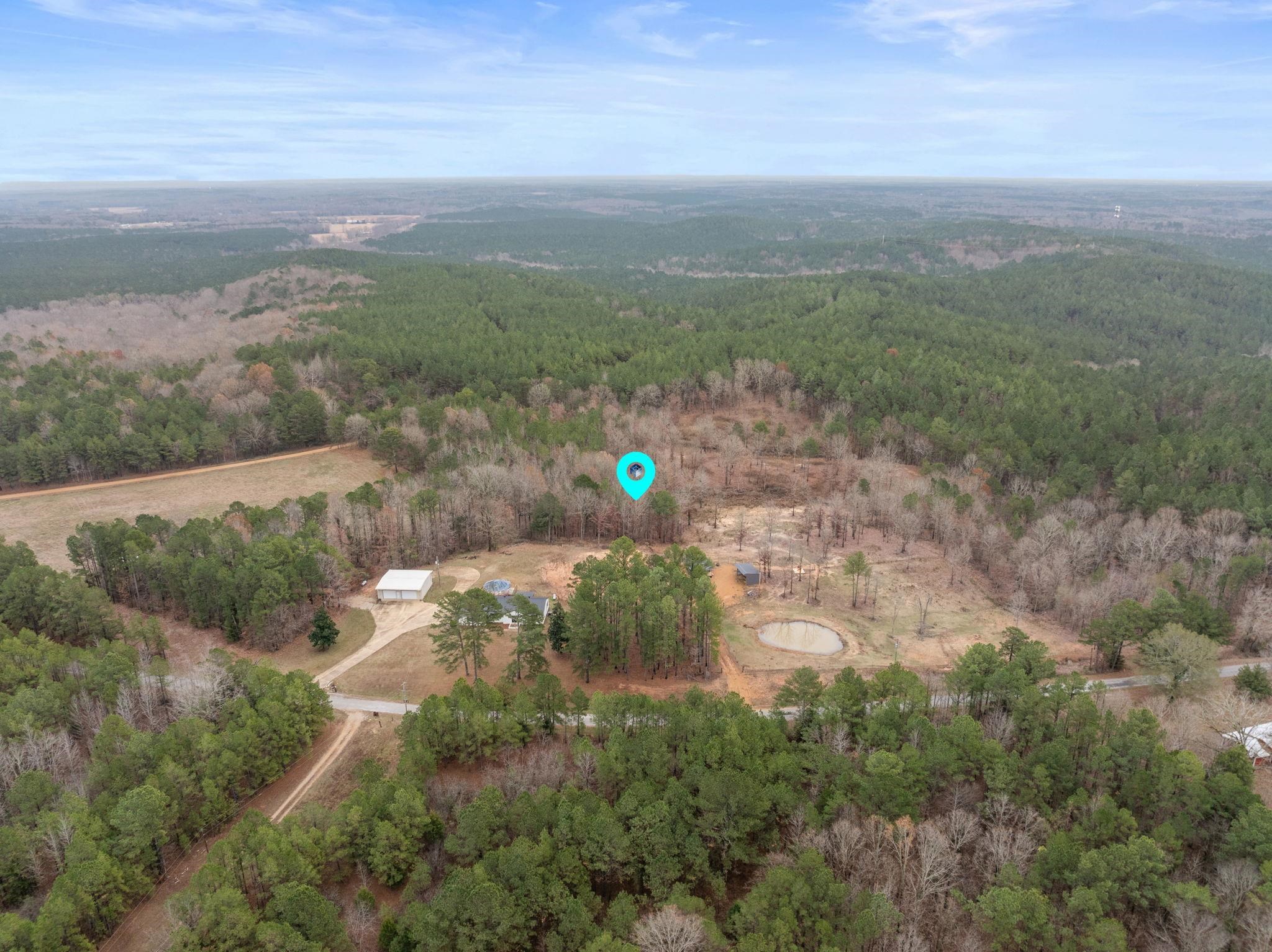 310 County Road 638 Corinth, MS 38834 - Photo 39 of 40 Aerial overview of property's location featuring a heavily wooded area