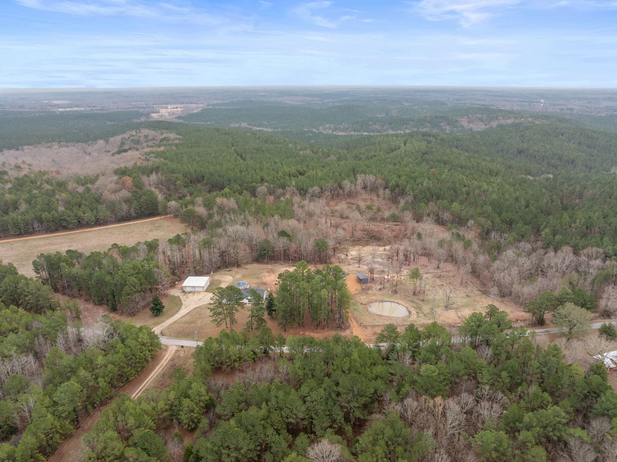 310 County Road 638 Corinth, MS 38834 - Photo 40 of 40 Aerial view of property and surrounding area featuring a forest