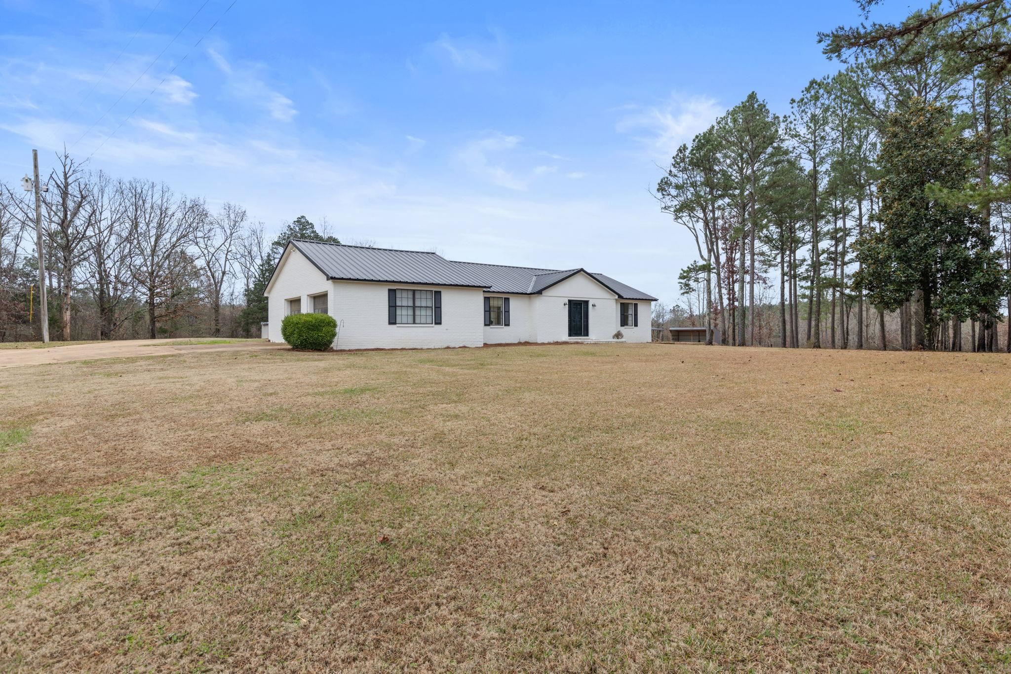 310 County Road 638 Corinth, MS 38834 - Photo 8 of 40 View of front of home featuring a front lawn and a metal roof