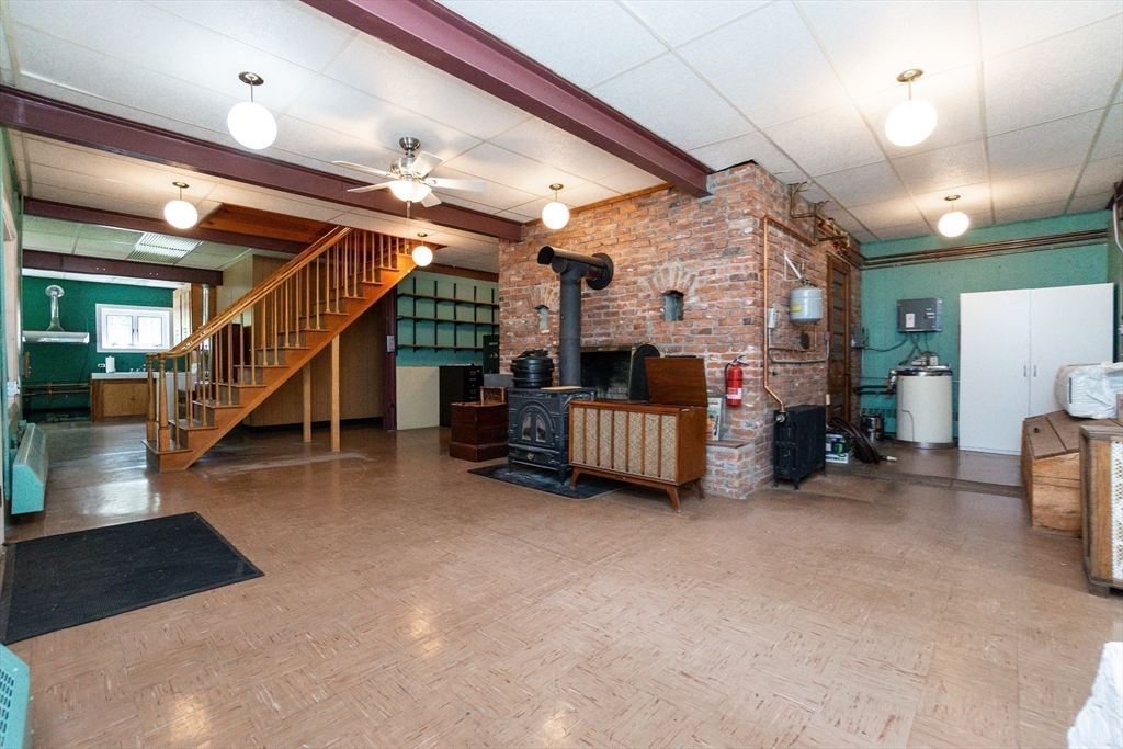 152 Stowell Road Ashburnham, MA 01430 - Photo 17 of 38 a big room with lots of furniture and a chandelier