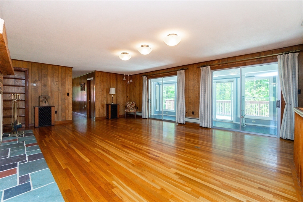 152 Stowell Road Ashburnham, MA 01430 - Photo 2 of 38 a view of empty room with wooden floor and fan