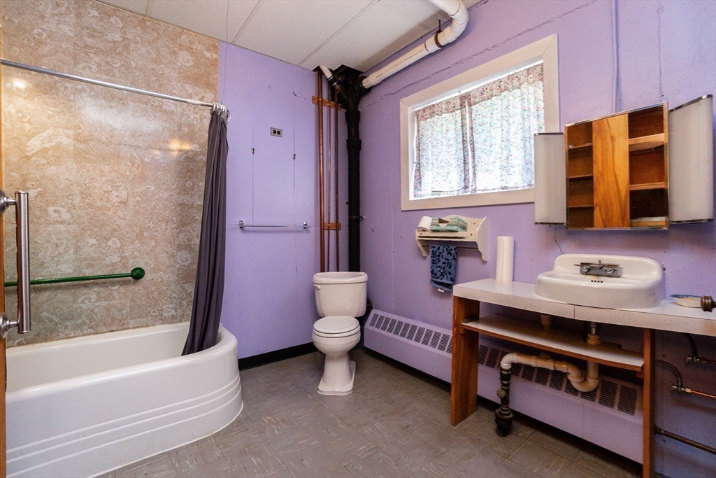 152 Stowell Road Ashburnham, MA 01430 - Photo 21 of 38 a bathroom with a bathtub sink and toilet