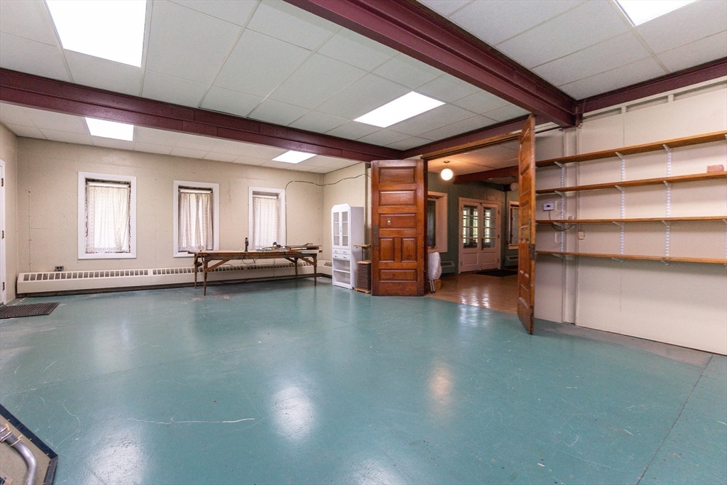 152 Stowell Road Ashburnham, MA 01430 - Photo 22 of 38 a view of a room with gym equipment and a large window