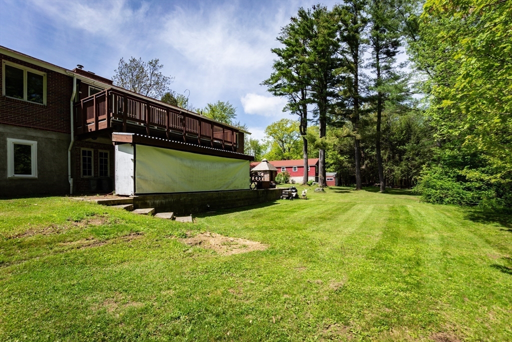 152 Stowell Road Ashburnham, MA 01430 - Photo 31 of 38 a yellow house with tree in front of it