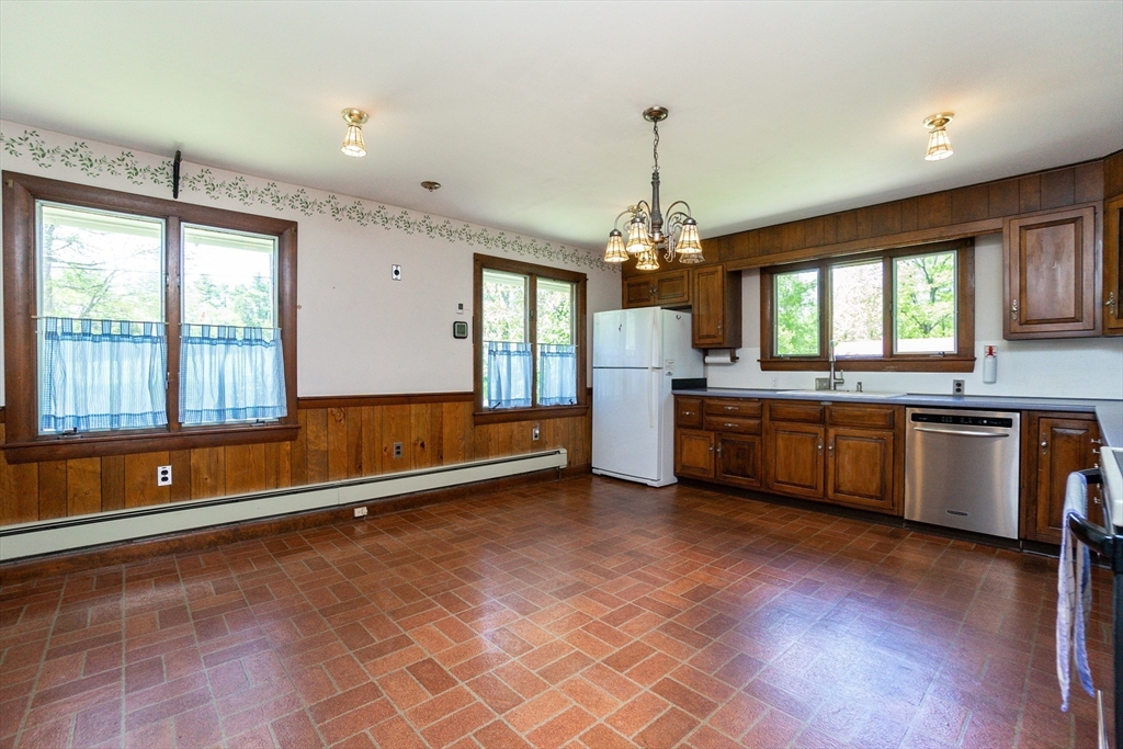 152 Stowell Road Ashburnham, MA 01430 - Photo 5 of 38 a kitchen with granite countertop a sink cabinets and window