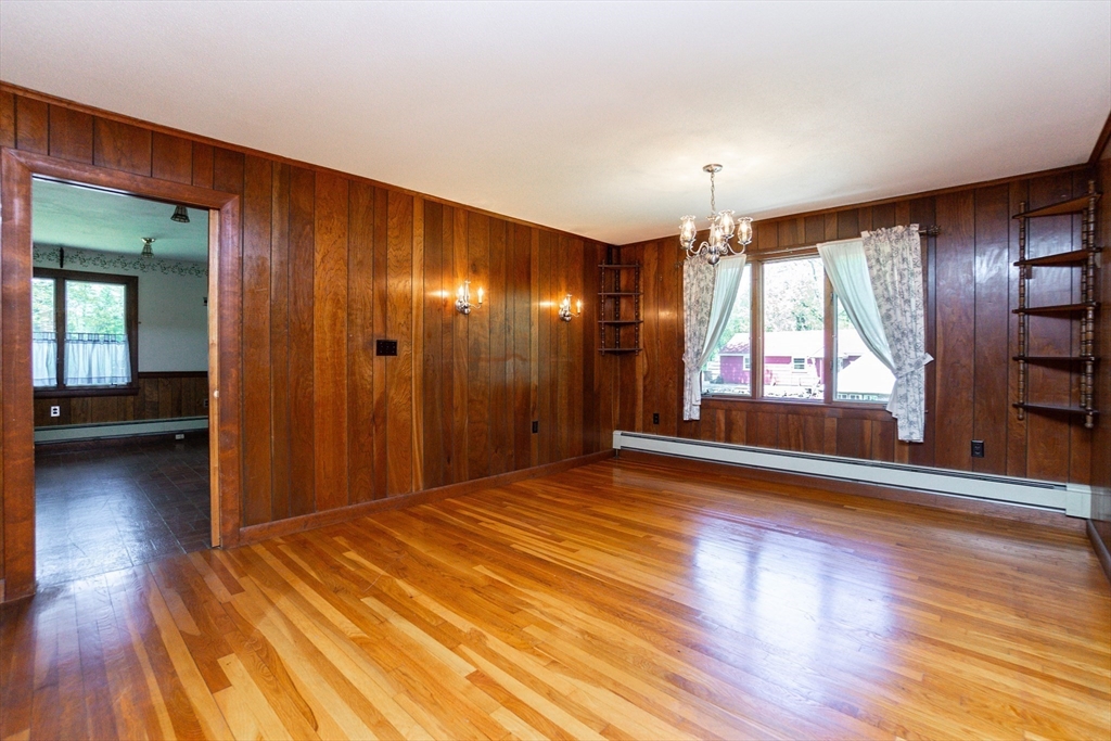 152 Stowell Road Ashburnham, MA 01430 - Photo 7 of 38 a view of empty room with wooden floor and fan