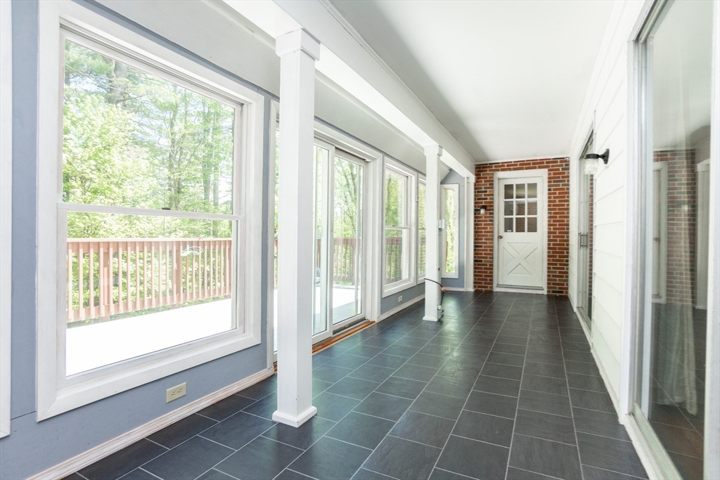 152 Stowell Road Ashburnham, MA 01430 - Photo 9 of 38 a view of hallway with furniture and a large window