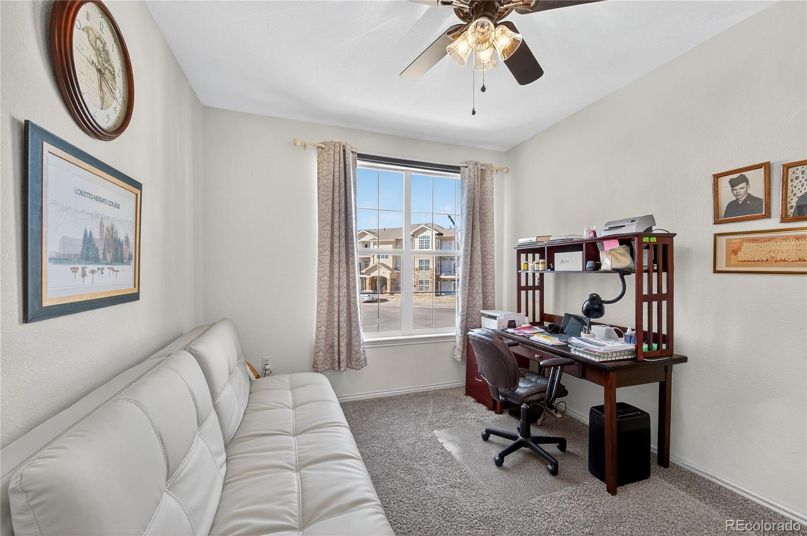 18611 Stroh Road, Unit 5203 Parker, CO 80134 - Photo 10 of 28 a view of a livingroom with workspace and a window