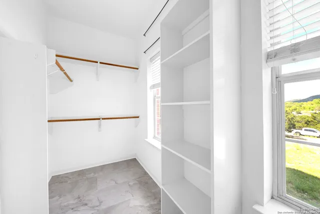 a view of an empty walk in closet