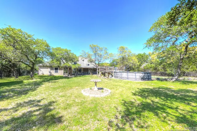 a view of a house with a yard porch and sitting area
