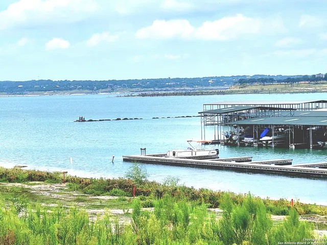a view of swimming pool with outdoor seating and yard in back