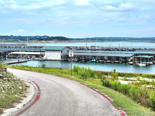 a view of a house with wooden fence
