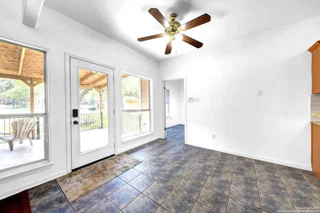 a view of an empty room with a window