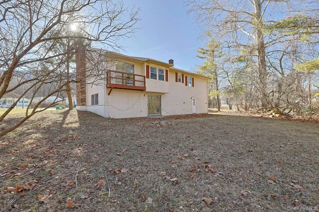 a view of a backyard with large trees