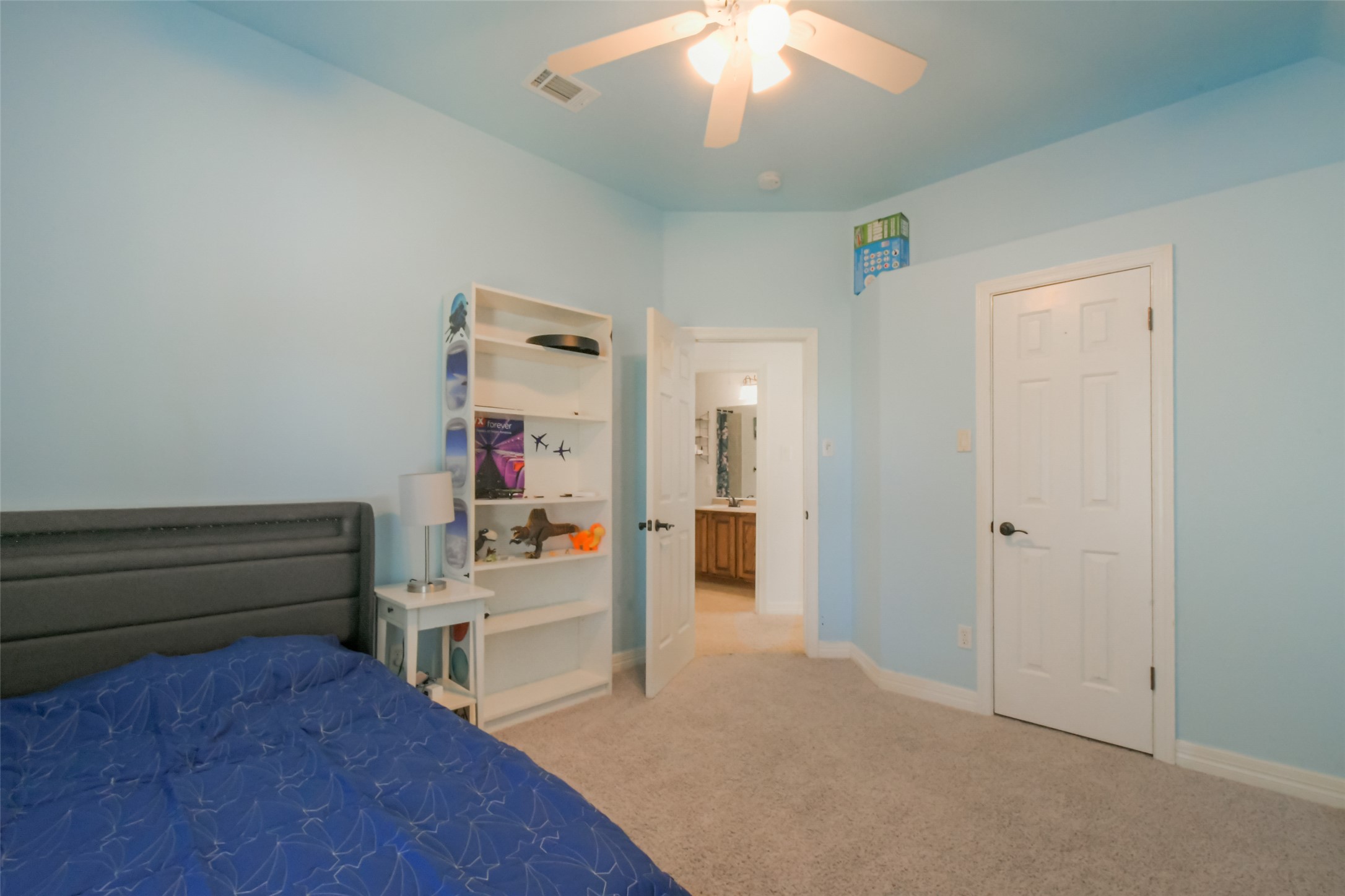 8903 Halder Cove Austin, TX 78717 - Photo 15 of 26 Bedroom 3 featuring light carpet and ceiling fan