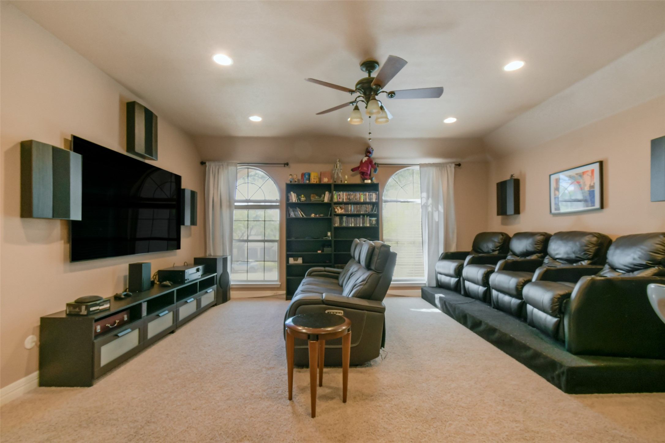 8903 Halder Cove Austin, TX 78717 - Photo 17 of 26 Living room with ceiling fan, light carpet, and recessed lighting