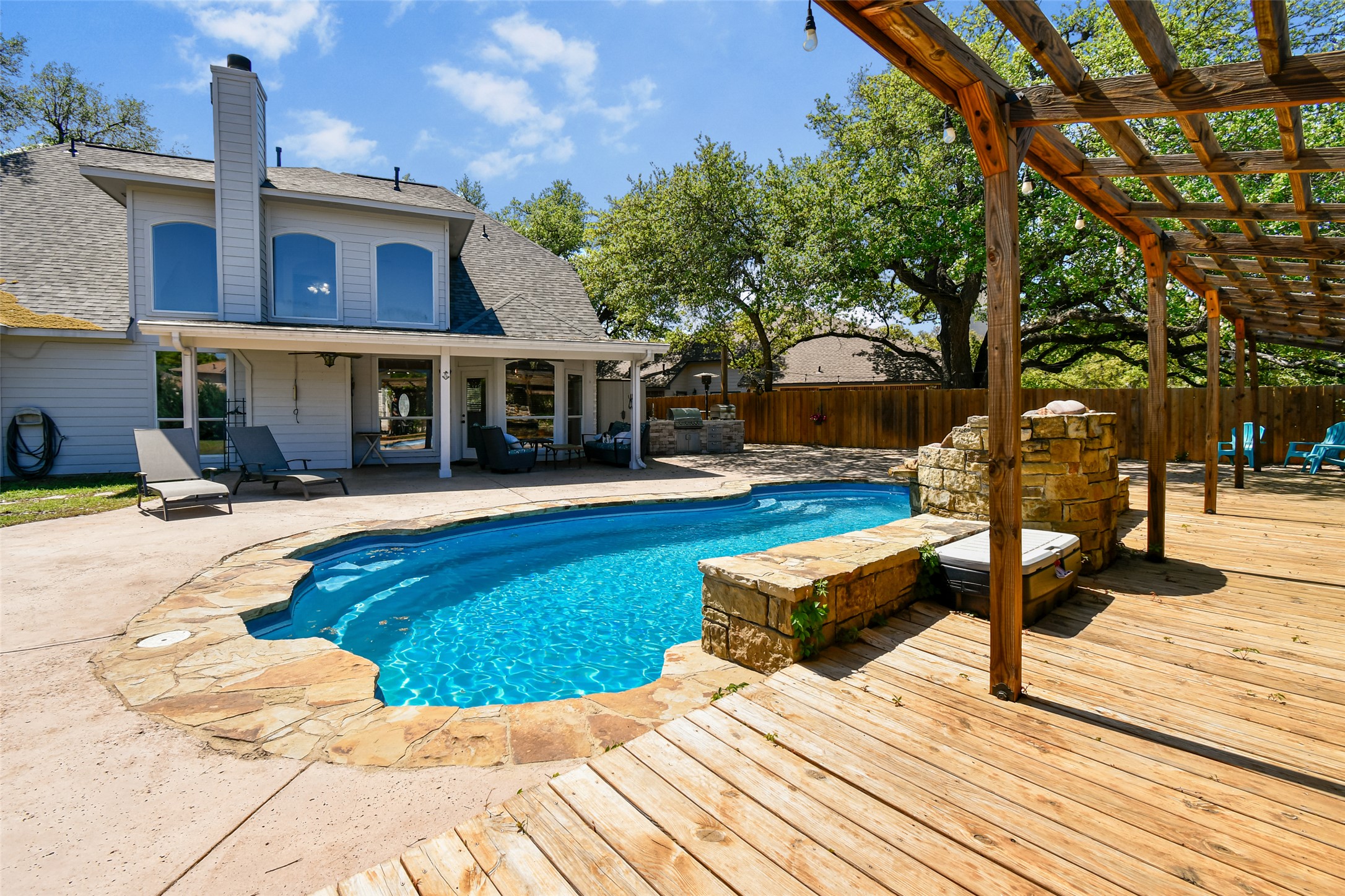 8903 Halder Cove Austin, TX 78717 - Photo 23 of 26 View of swimming pool featuring patio surround and a fenced backyard