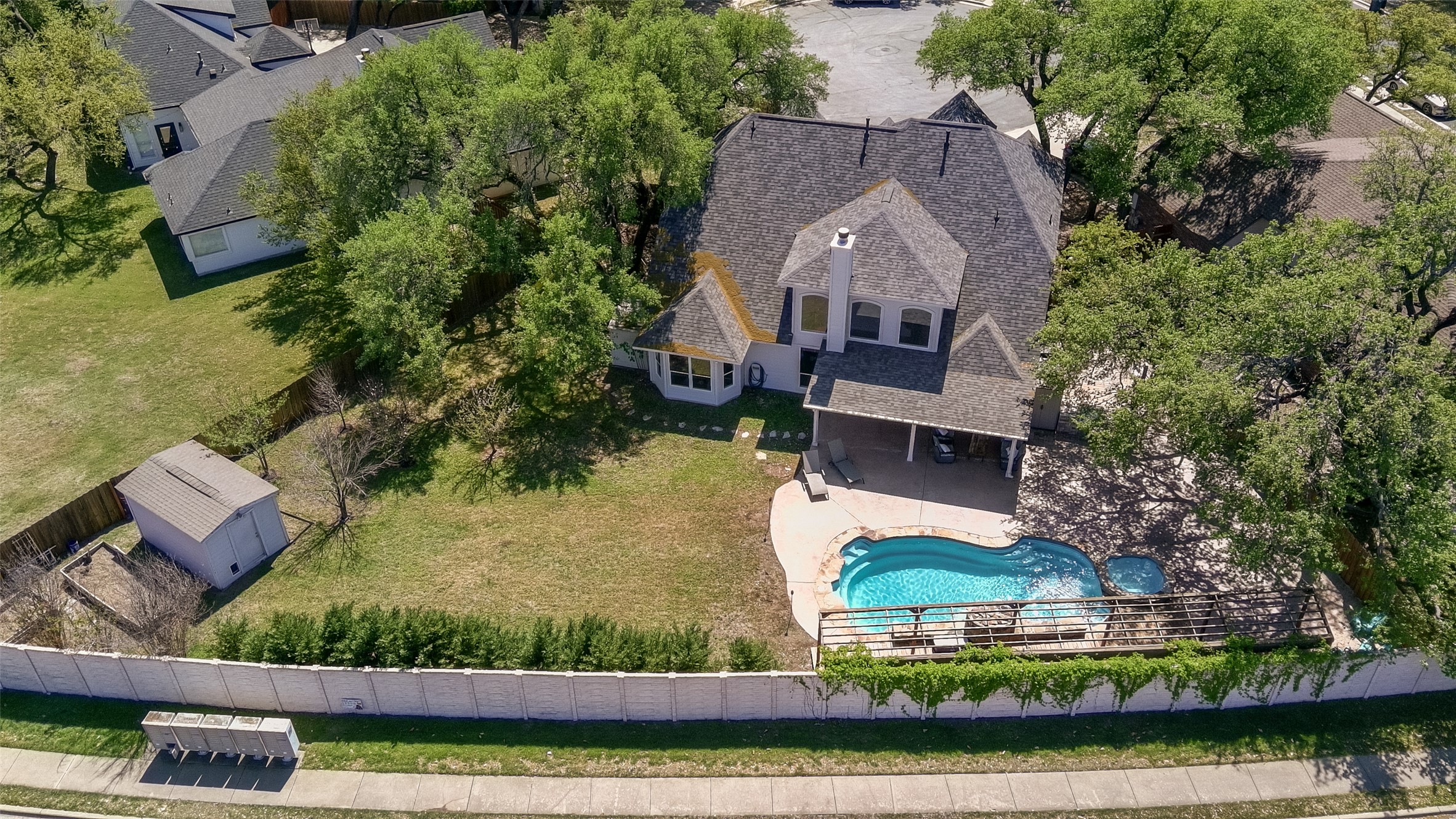 8903 Halder Cove Austin, TX 78717 - Photo 26 of 26 Aerial view of property and surrounding area with a pool