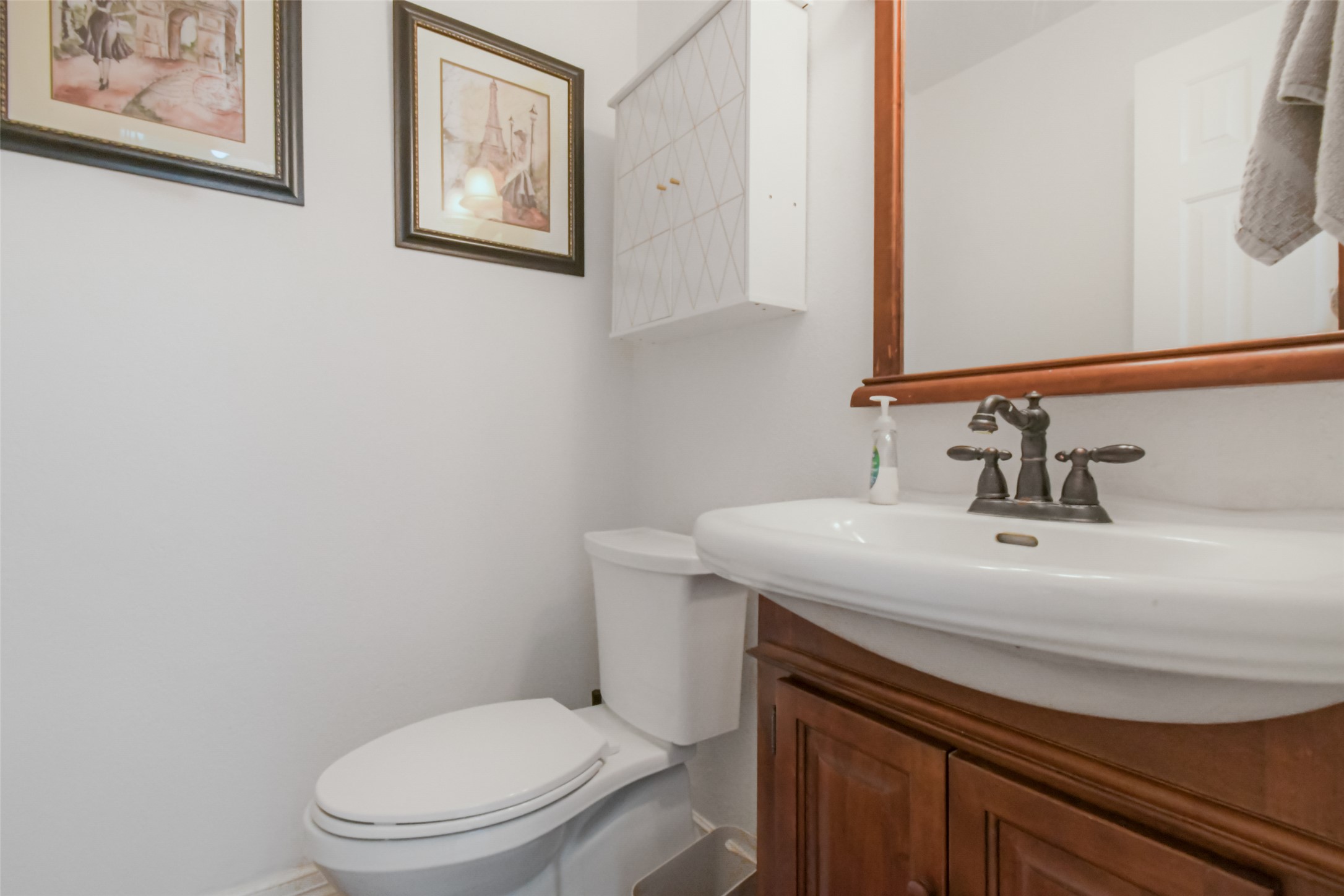 8903 Halder Cove Austin, TX 78717 - Photo 9 of 26 Half bathroom with vanity and toilet