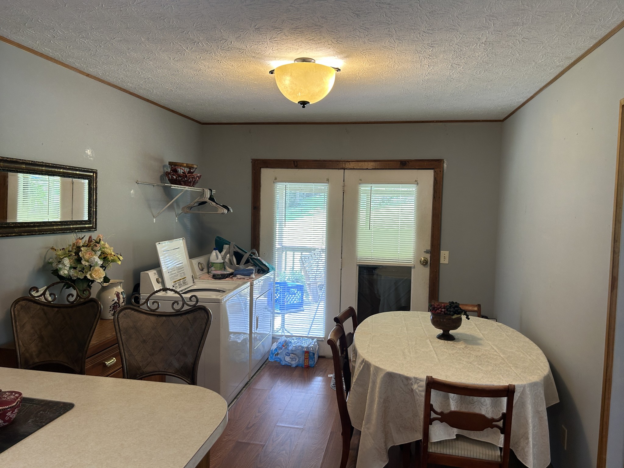 1041 Roysden Road Jamestown, TN 38556 - Photo 11 of 18 a living room with furniture a chandelier and a window