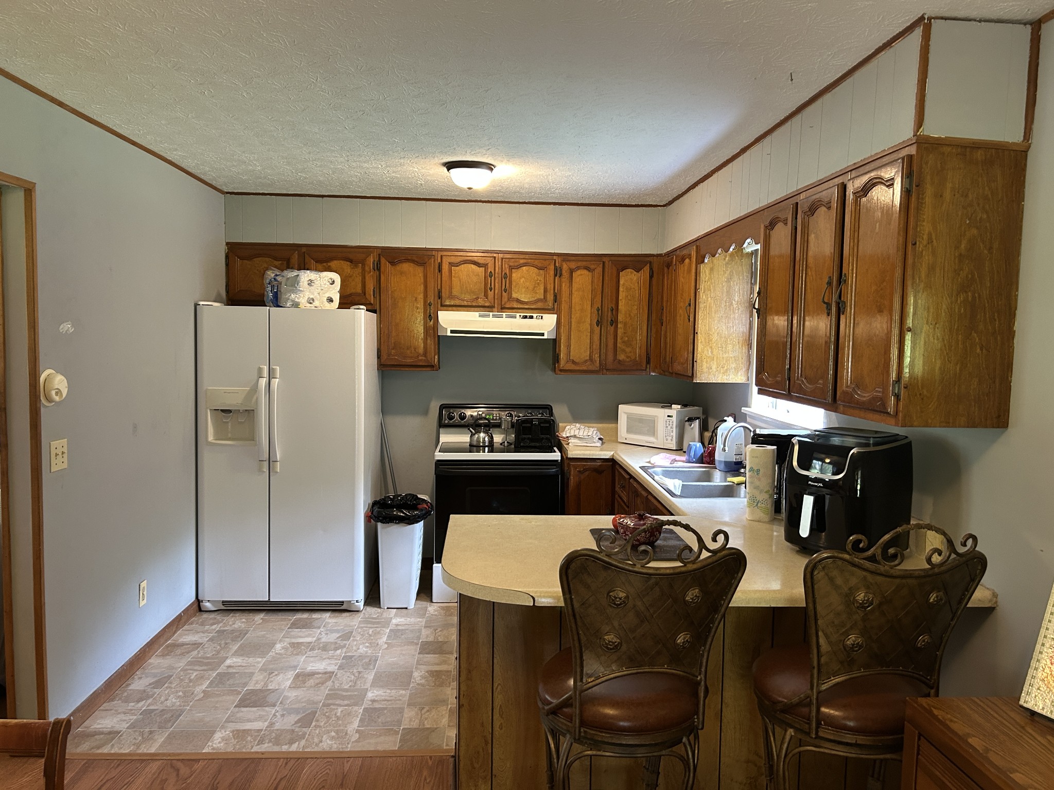 1041 Roysden Road Jamestown, TN 38556 - Photo 14 of 18 a kitchen with a refrigerator and a stove top oven