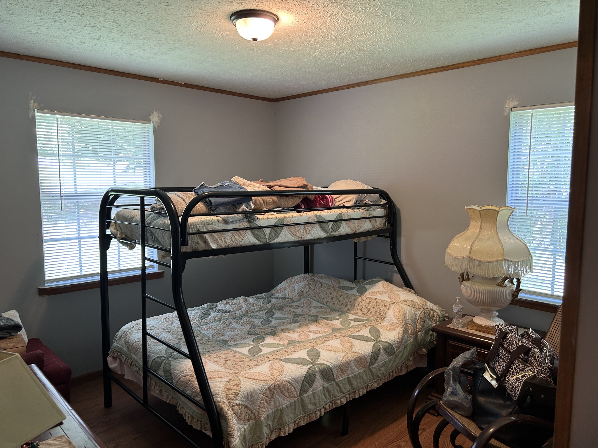 1041 Roysden Road Jamestown, TN 38556 - Photo 15 of 18 a bed sitting in a bedroom next to a window