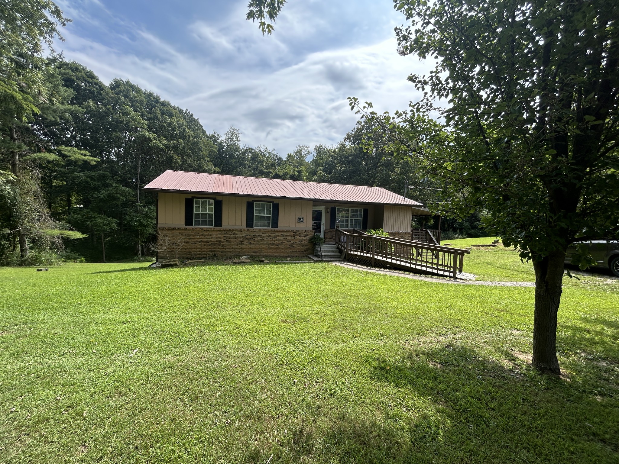 1041 Roysden Road Jamestown, TN 38556 - Photo 2 of 18 a view of a house with a yard