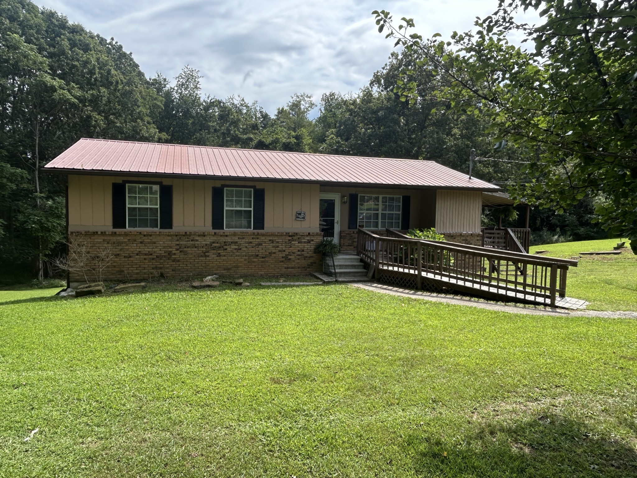 1041 Roysden Road Jamestown, TN 38556 - Photo 3 of 18 a front view of a house with a yard