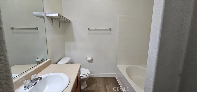 an empty room with a empty space and windows