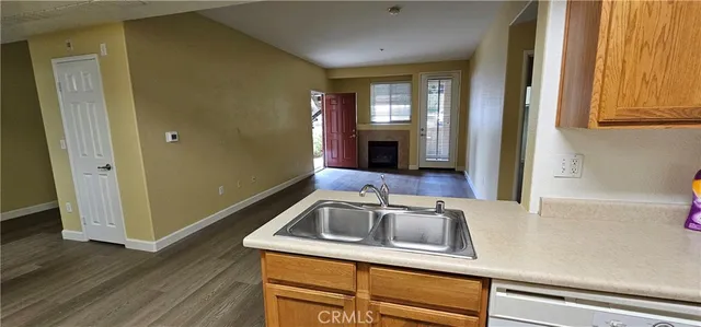 a kitchen with a sink and a refrigerator