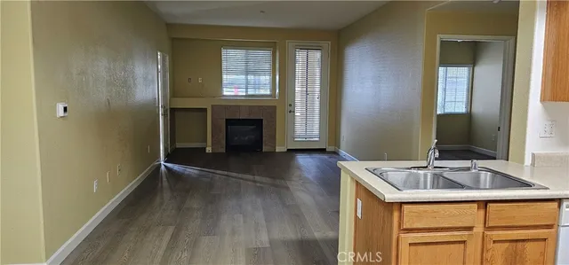 a kitchen with granite countertop a sink and a stove top oven
