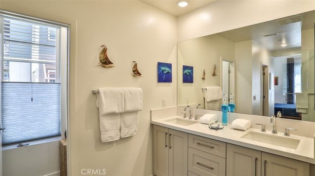 a bathroom with a sink toilet and a mirror