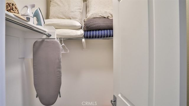 a front view of a multi story building with a yard