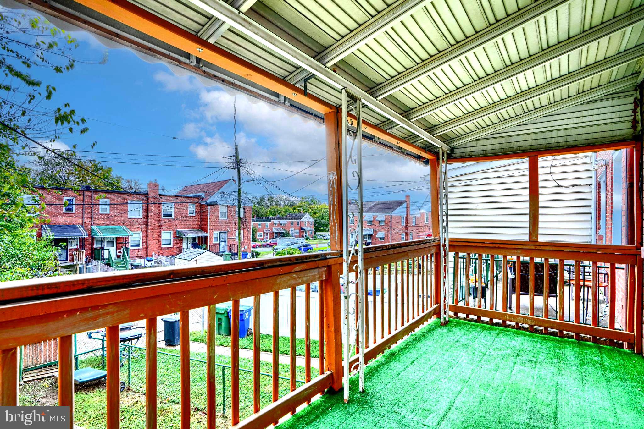 755 South Woodington Road Baltimore, MD 21229 - Photo 16 of 40 a view of a porch with a yard