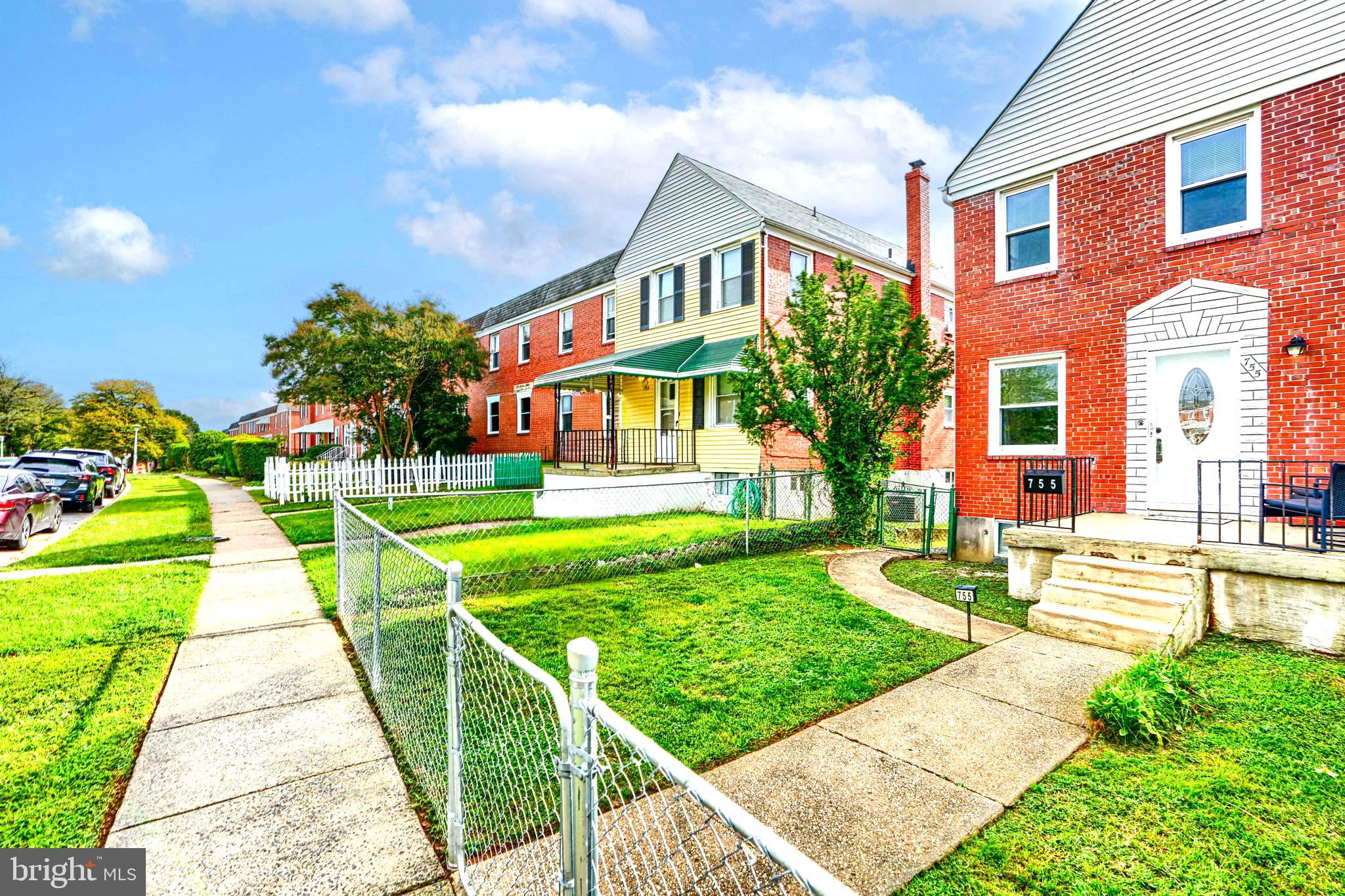 755 South Woodington Road Baltimore, MD 21229 - Photo 2 of 40 a front view of building with yard